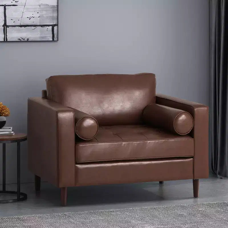 Fauteuil club capitonné contemporain en similicuir  avec traversins