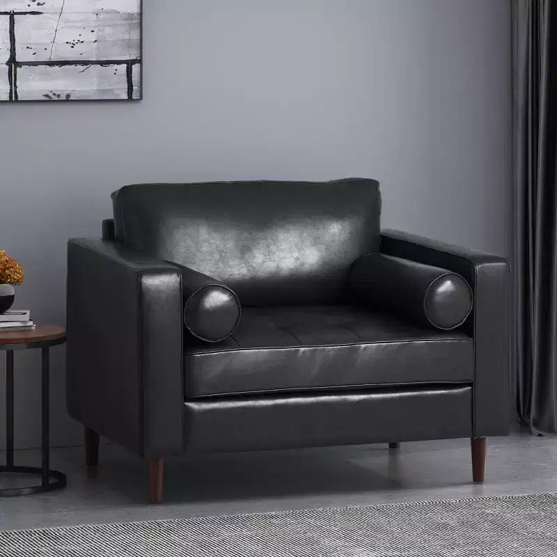 Fauteuil club capitonné contemporain en similicuir  avec traversins