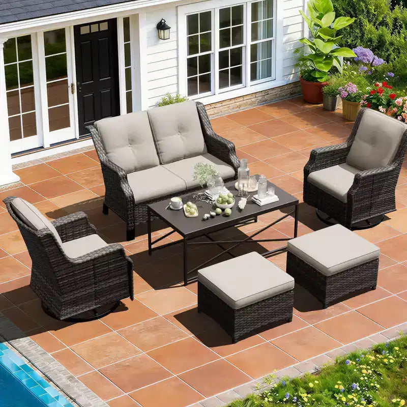 Salon de jardin UPTIOT avec canapé, fauteuils à bascule, poufs et table basse pour un confort relaxant dans le jardin.