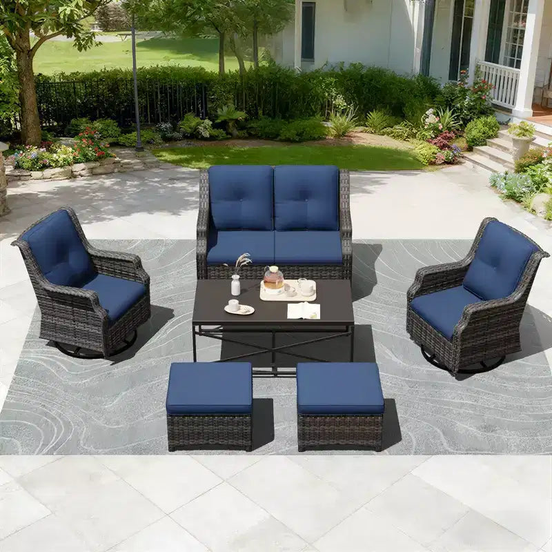 Salon de jardin UPTIOT avec canapé, fauteuils à bascule, poufs et table basse pour un confort relaxant dans le jardin.