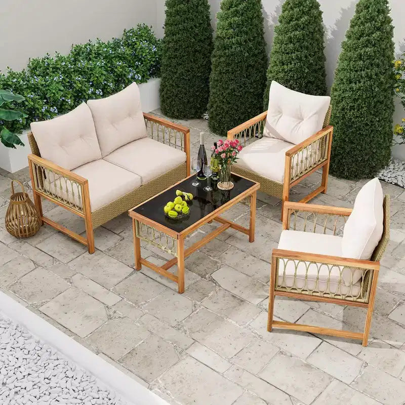 Ensemble de mobilier de patio Costway 4 pièces avec cadre en bois d'acacia, coussins et table basse