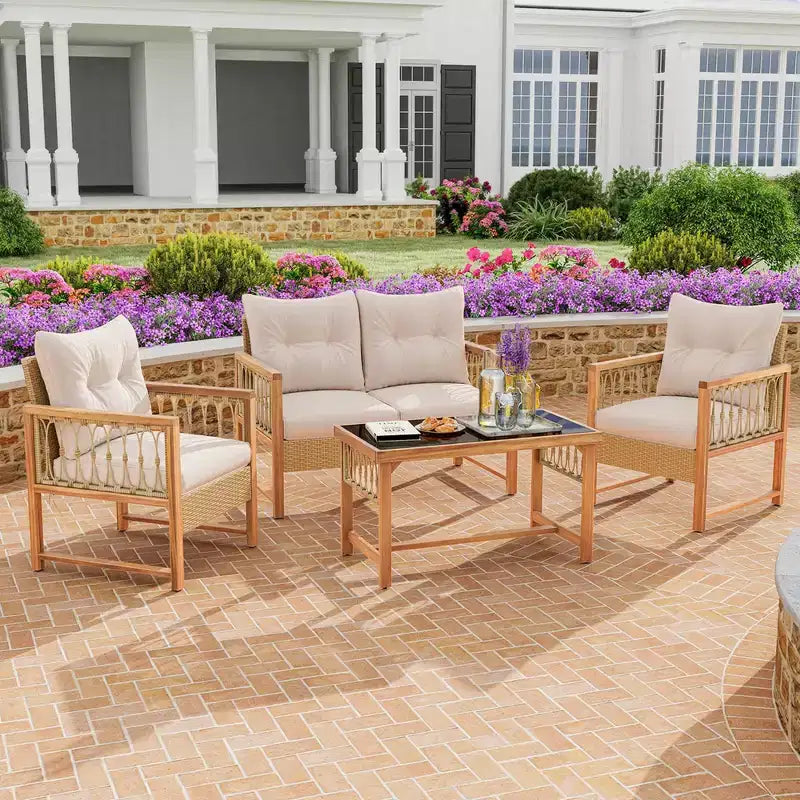 Ensemble de mobilier de patio Costway 4 pièces avec cadre en bois d'acacia, coussins et table basse